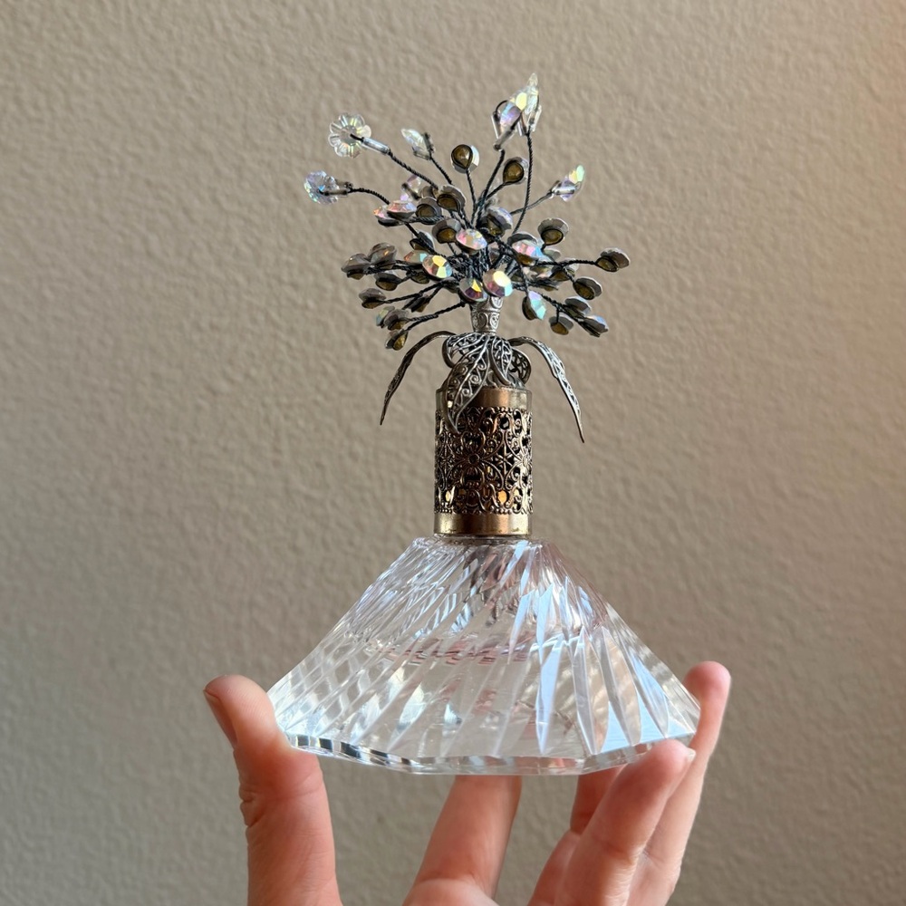 Elegant Crystal Perfume Bottle With Silver Filigree Decorative Top